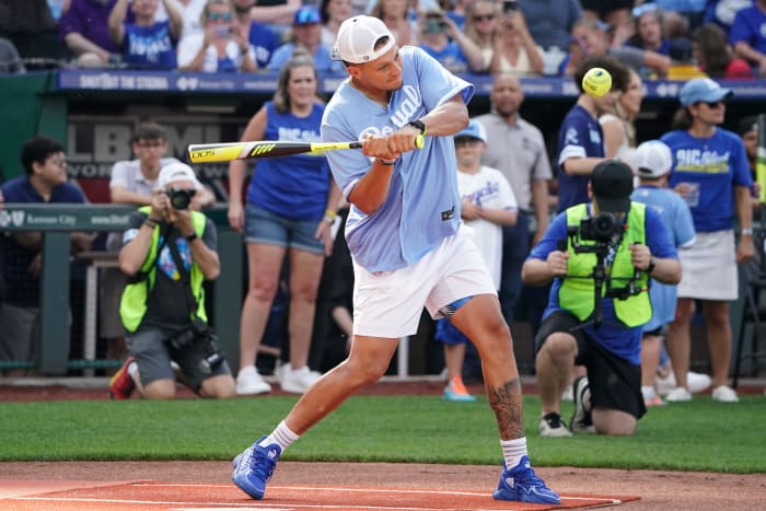 Patrick Mahomes swings the bat during a celebrity softball game.